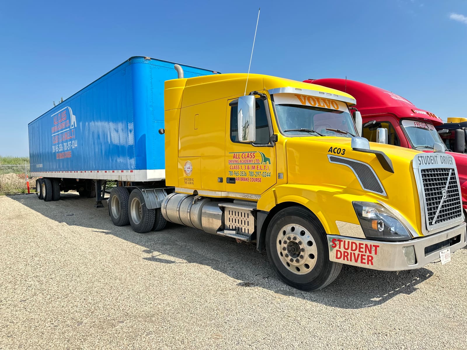 All Class Driving Academy Volvo truck and trailer parked in the yard